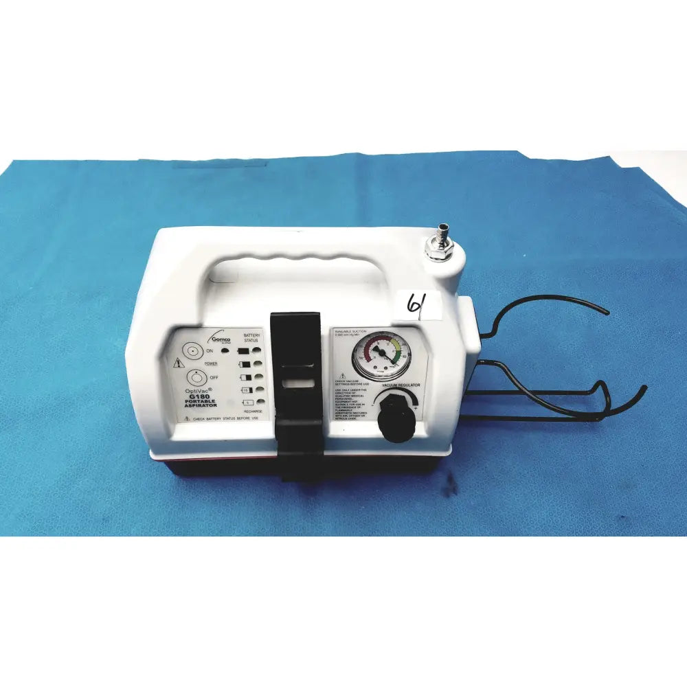 White plastic allied healthcare gomco optivac g180 portable aspirator with black control panel pressure gauge and handle
