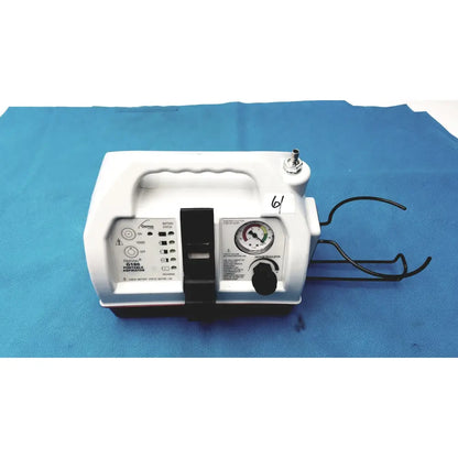 White plastic allied healthcare gomco optivac g180 portable aspirator with black control panel pressure gauge and handle