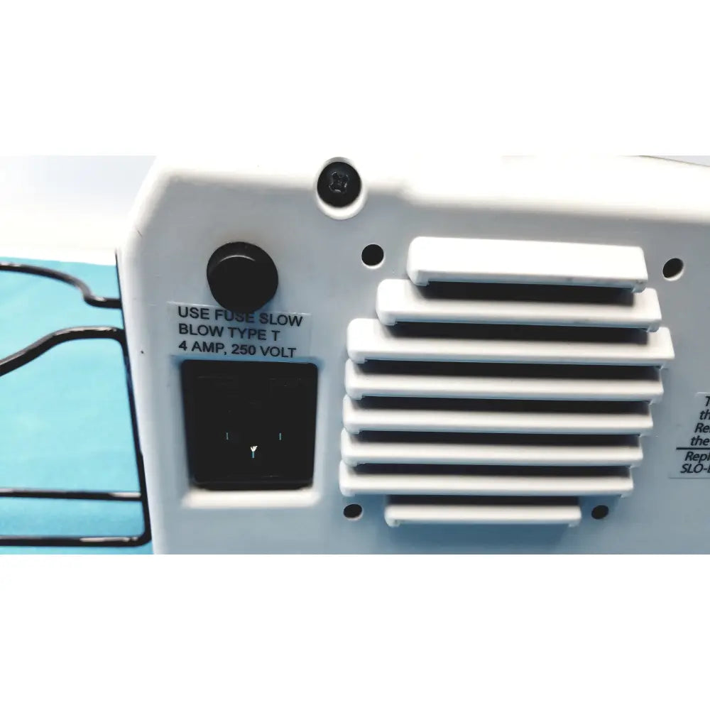 White plastic allied healthcare gomco optivac g180 portable aspirator with black fuse holder and ventilation slats