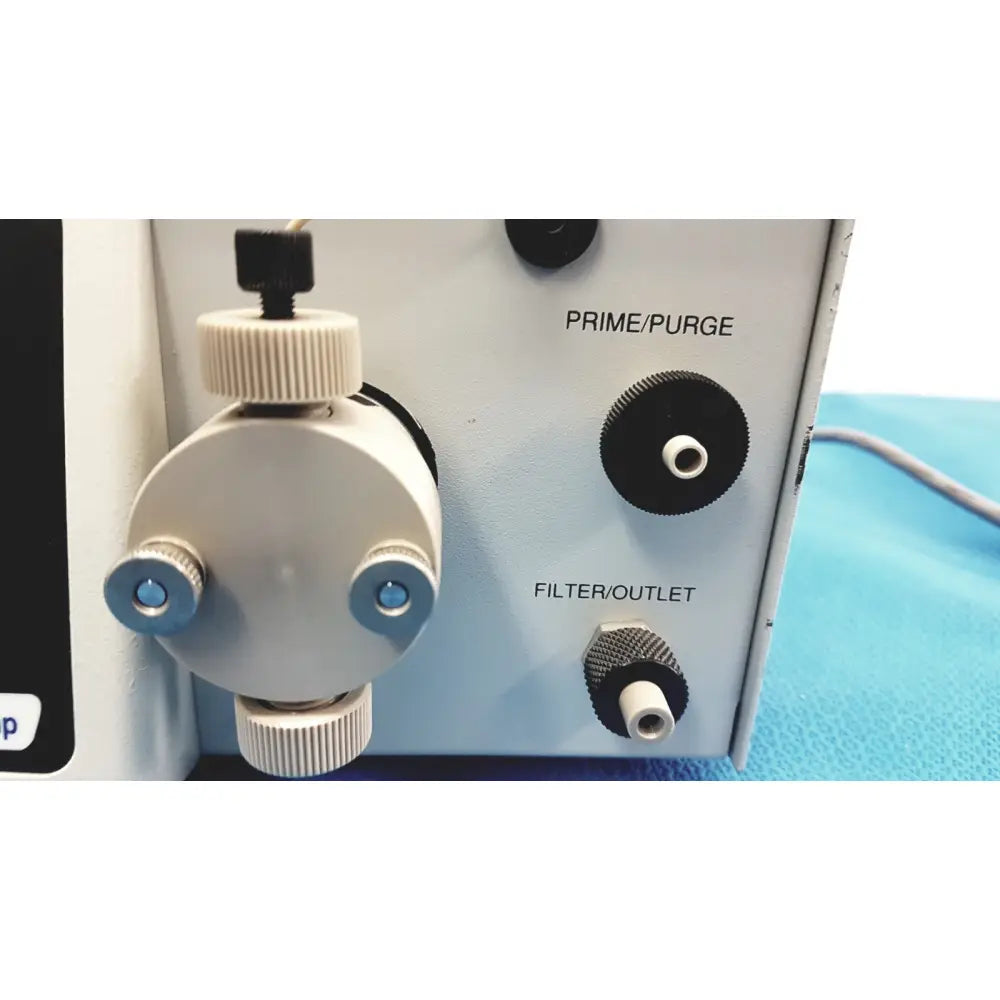 Gray plastic Alltech 301 pump HPLC laboratory unit with black knobs and blue-tinted prime purge fittings