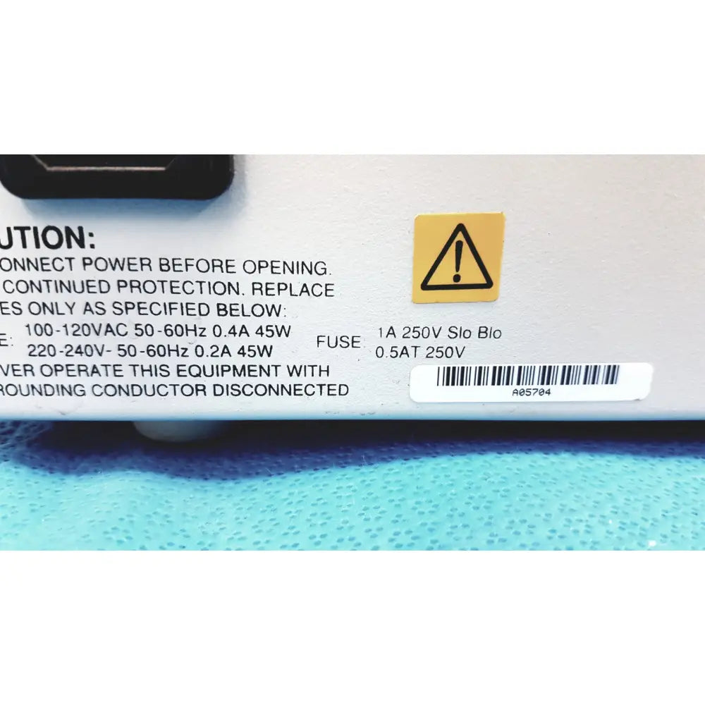 White plastic power supply unit with black text and yellow warning label for alltech 301 pump hplc laboratory use