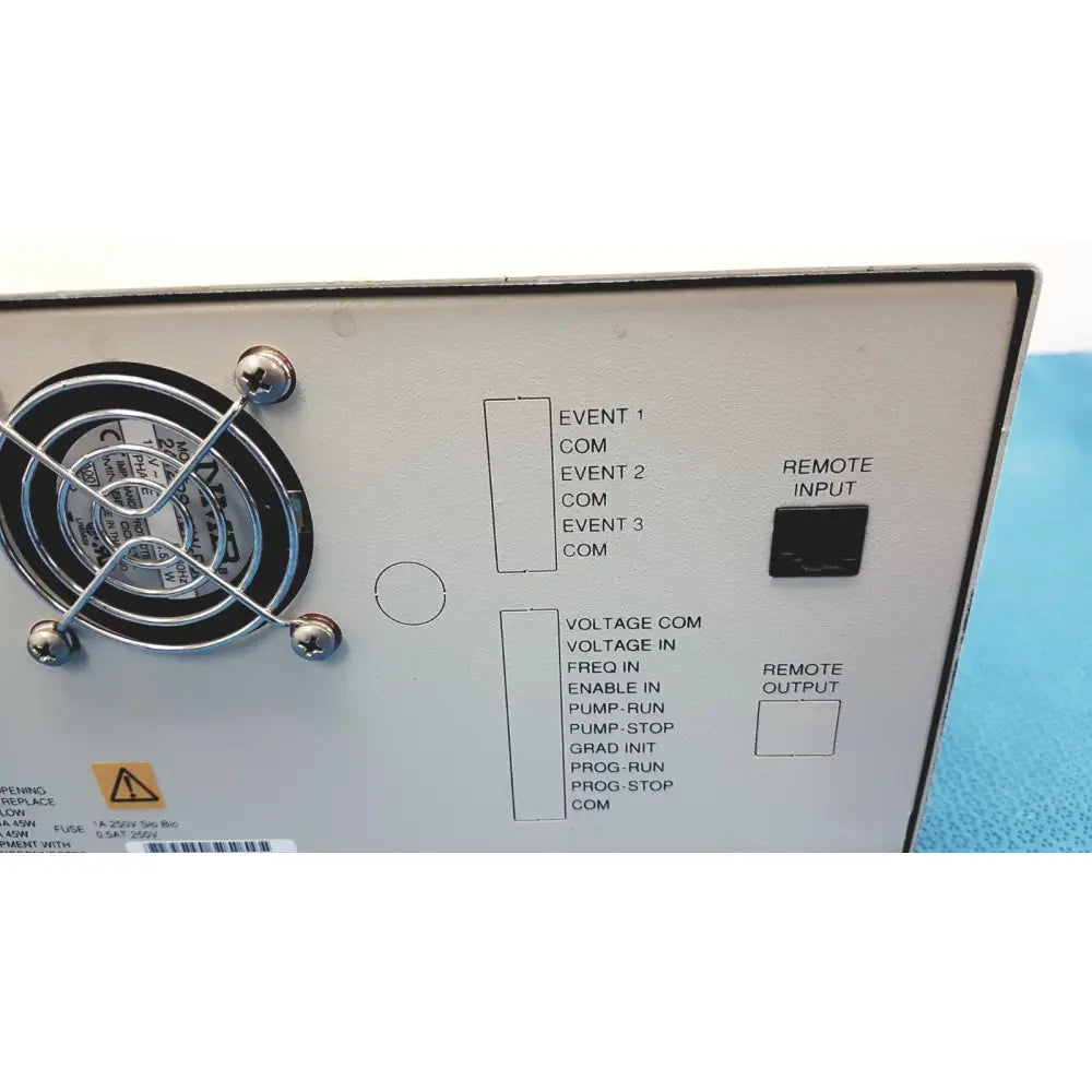 White alltech 301 pump hplc laboratory control panel with black labeled ports and circular fan on the left side back view