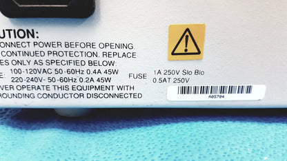 White plastic power supply unit with black text and yellow warning label for alltech 301 pump hplc laboratory use