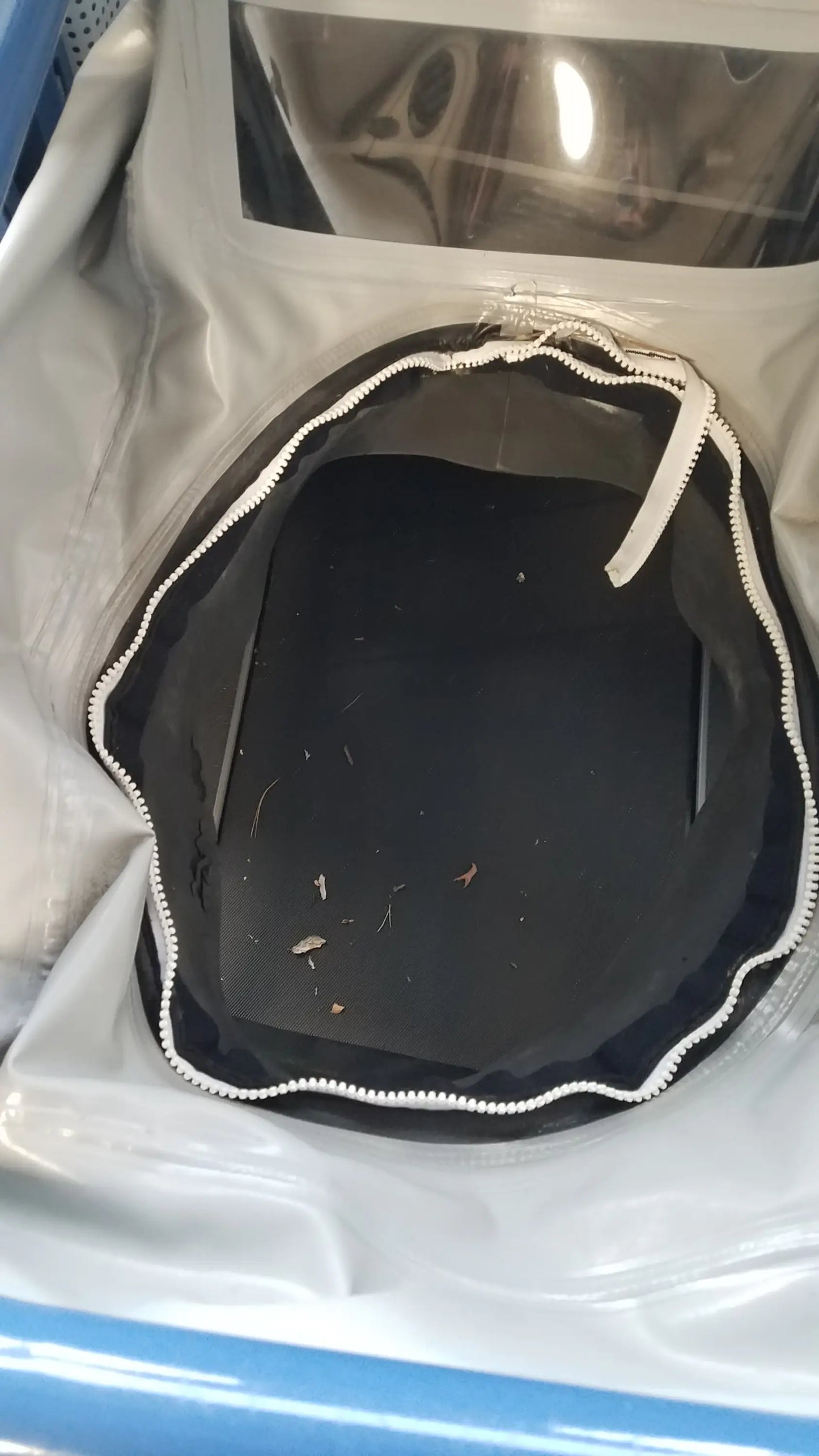 Black circular zippered container with scalloped edge and white trim for alter g m320 anti-gravity treadmill adjustable body-weight support