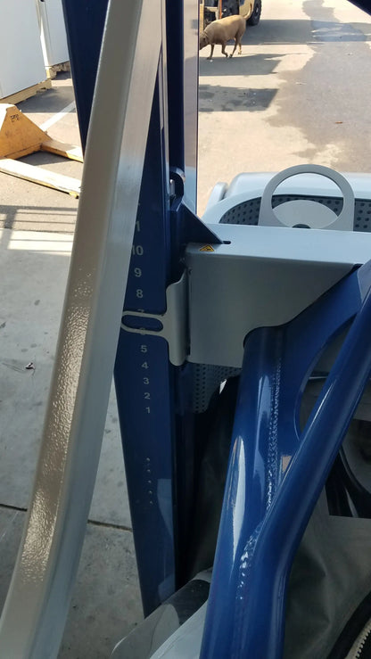 Blue metal height adjustment bracket with white numerical markings on alter g m320 anti-gravity treadmill for adjustable body-weight support