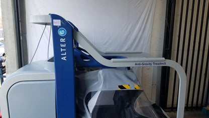 Alter G M320 anti-gravity treadmill in blue and white with adjustable body-weight support and sleek modern design