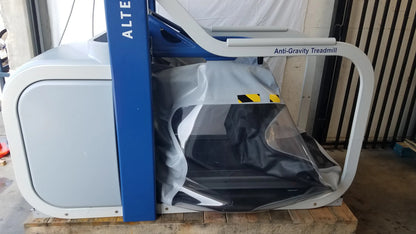 Blue and white Alter G M320 anti-gravity treadmill with adjustable body-weight support wrapped in protective plastic