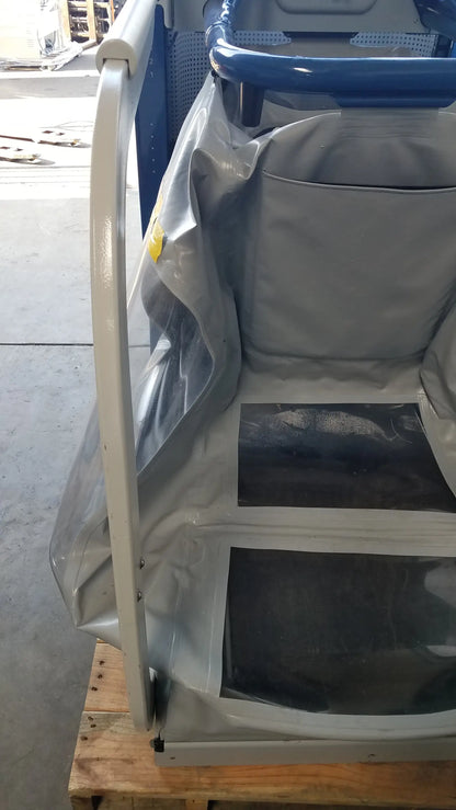 Gray fabric-covered bus seat with blue metal frame and black plastic inserts on alter g m320 anti-gravity treadmill with adjustable body-weight support