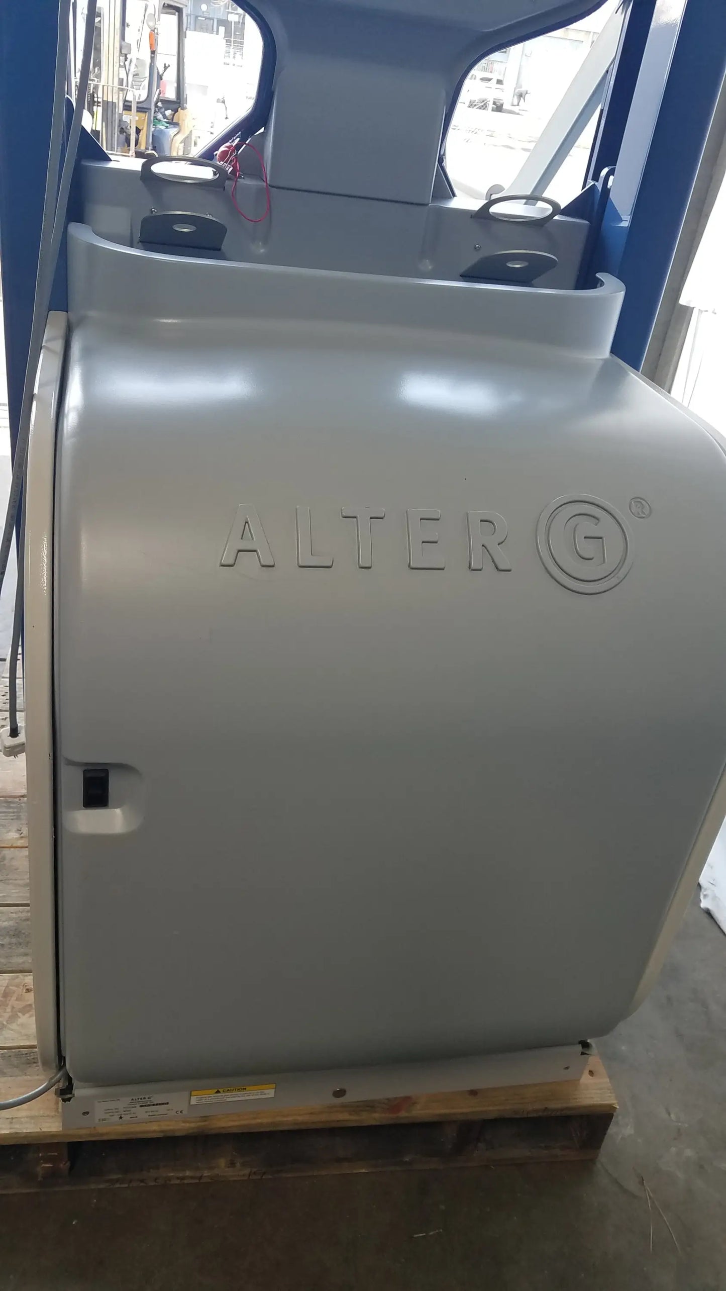 Gray Alter G M320 anti-gravity treadmill with sleek industrial design and adjustable body-weight support branding embossed