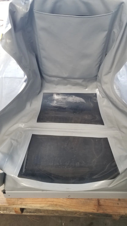 Gray protective cover with two black panels on the back of the Alter G M320 anti-gravity treadmill with adjustable body-weight support