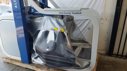 Alter G M320 anti-gravity treadmill with adjustable body-weight support featuring white and blue design and metallic running surface
