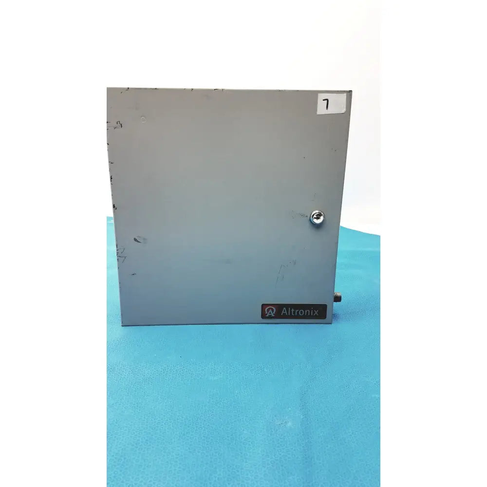 Gray metal industrial enclosure with silver screw and altronix label on the altronix al400ulx power supply charger