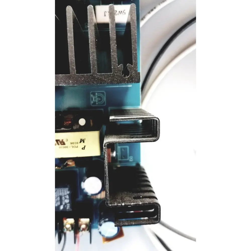 Black metal heat sink with ribbed design on altronix al400ulx power supply charger circuit board