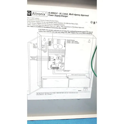 Altronix al400ulx power supply charger with schematic diagram and labeled components in black metal housing