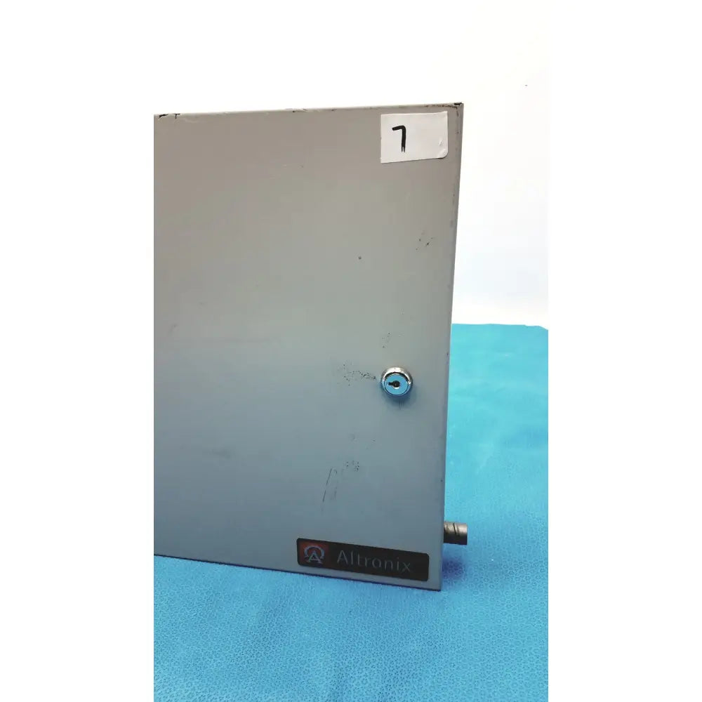 Gray metallic altronix al400ulx power supply charger enclosure with keyed lock and small protruding connector