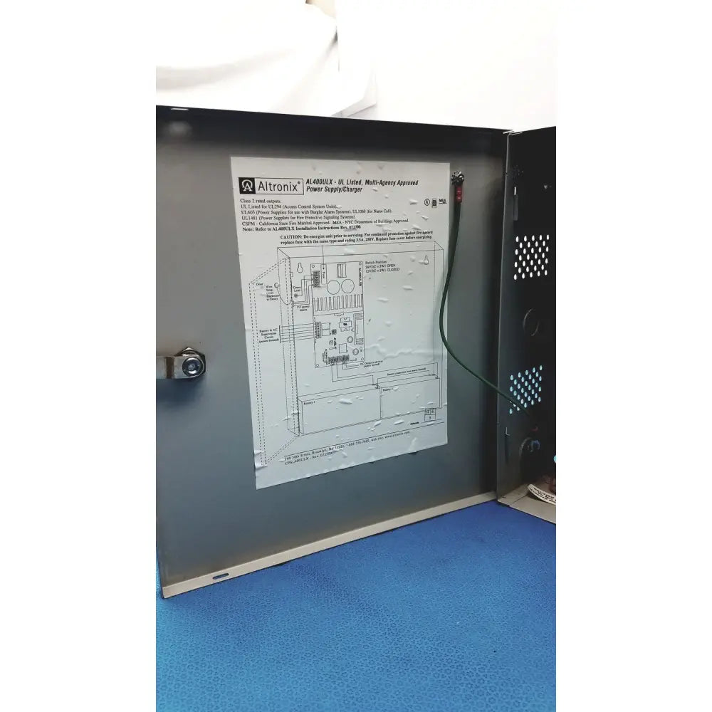 Altronix al400ulx power supply charger with metallic gray enclosure and visible internal wiring for multi-agency use