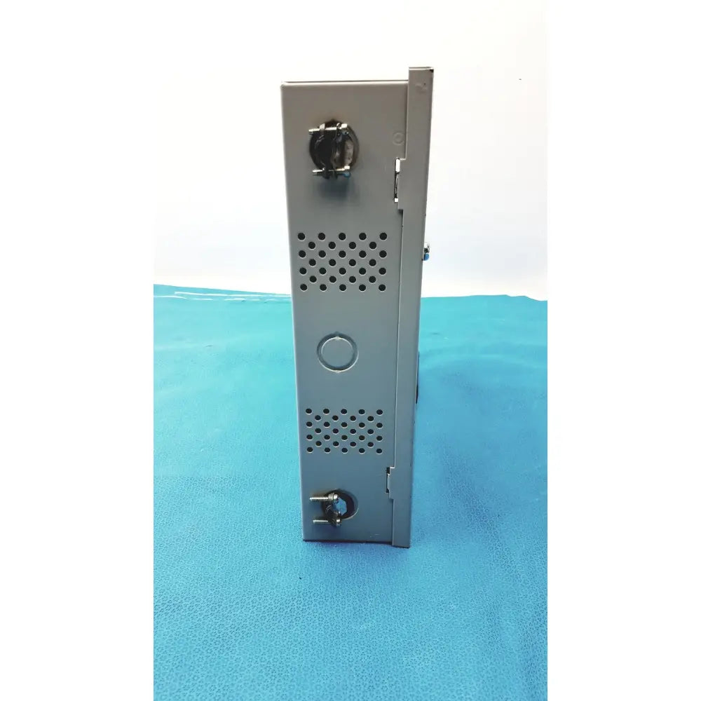 Gray metal server rack with perforated side panels and circular ports on the back of altronix al400ulx power supply