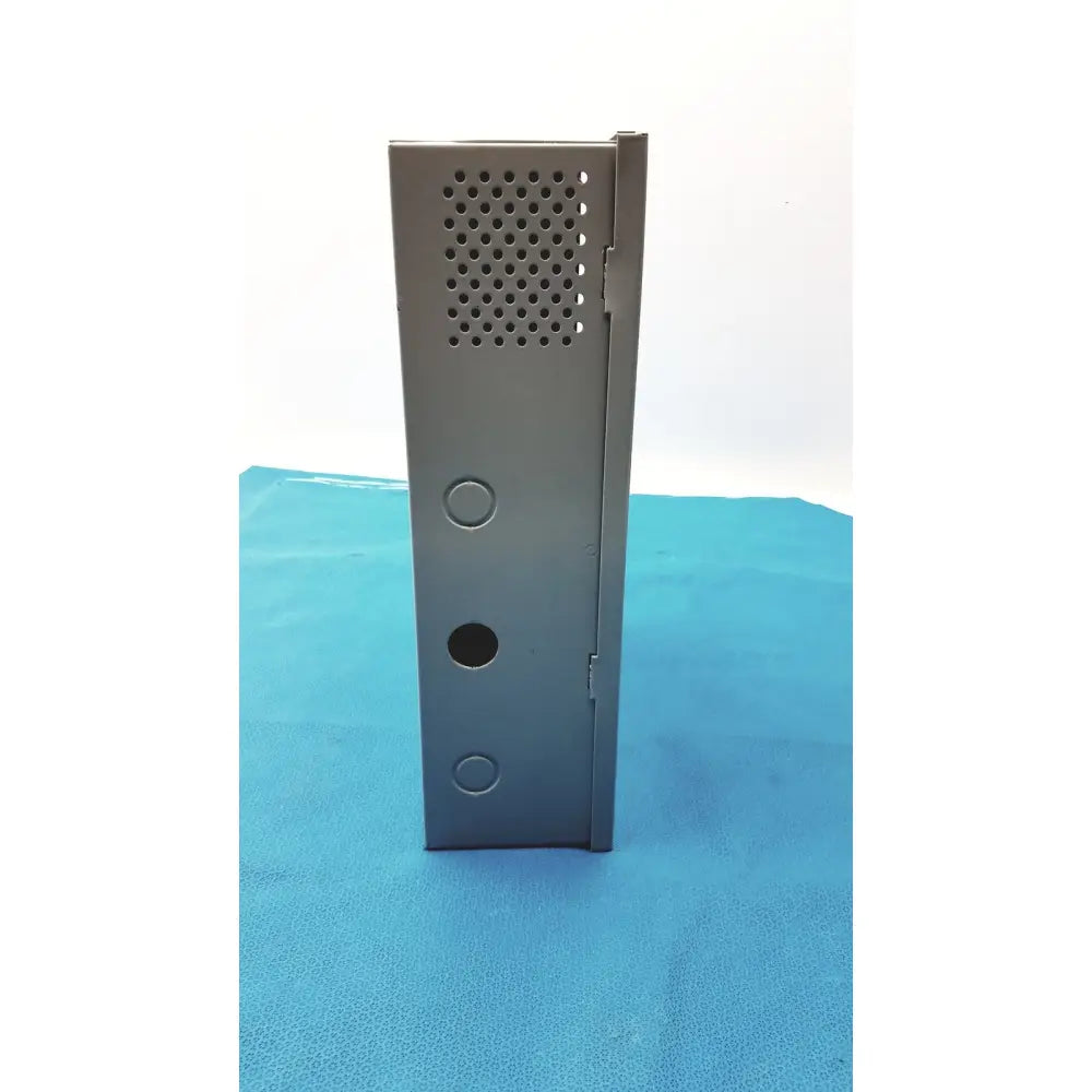 Gray metal enclosure of altronix smp5ctx high current power supply with perforated panel and circular mounting holes