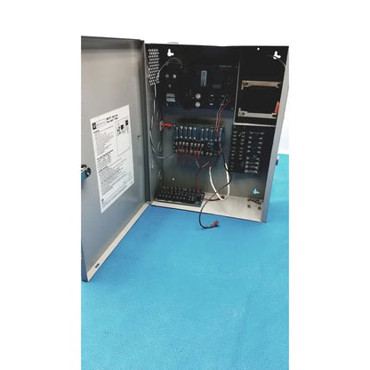 Gray metal electrical control panel showing wiring and circuitry inside of altronix smp5ctx high current power supply