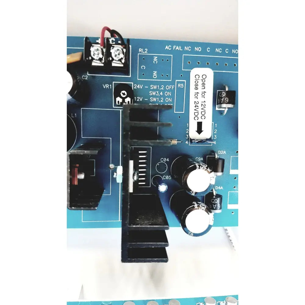 Blue circuit board with black components and white labeling of altronix smp5ctx high current power supply charger 12vdc 24vdc