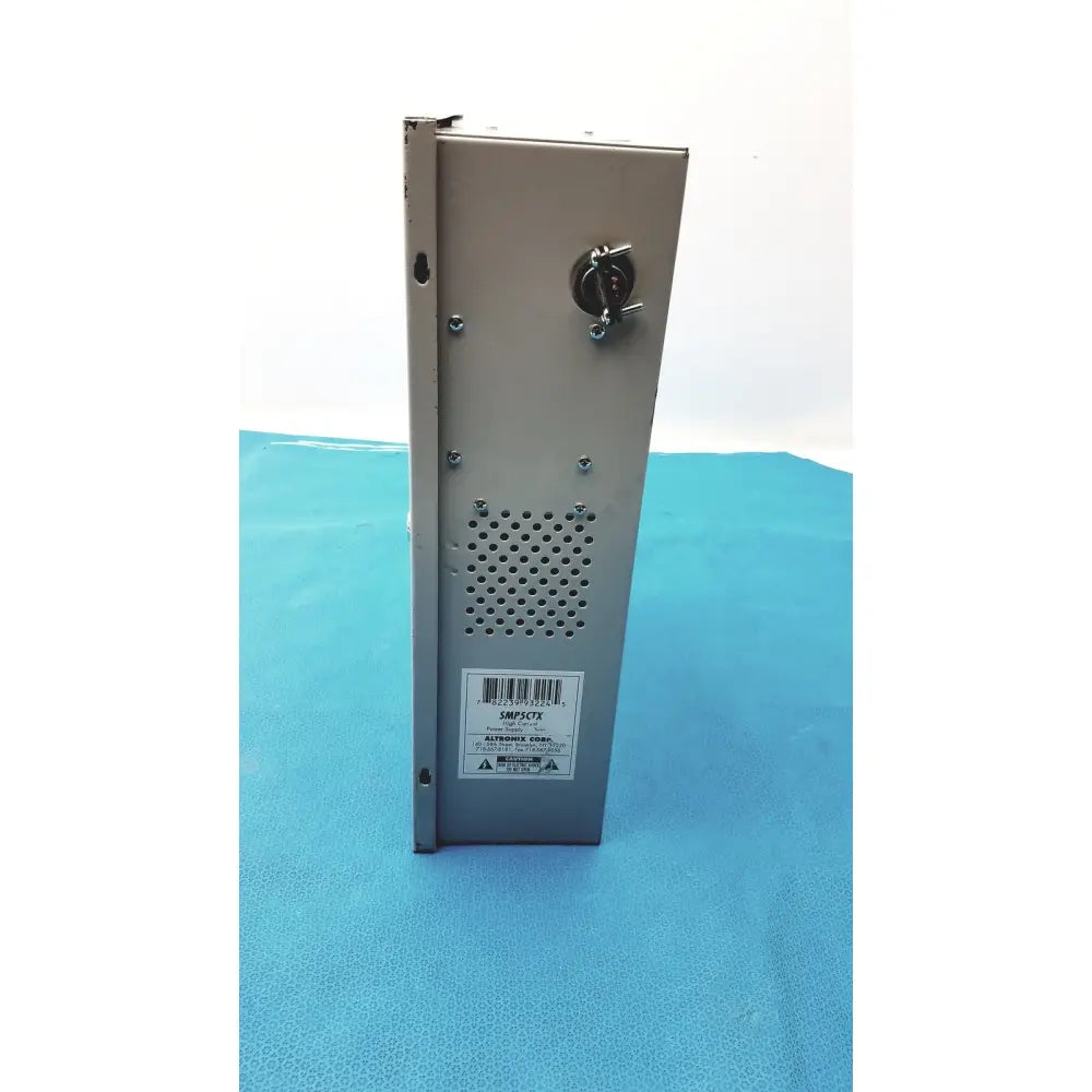 Silver metallic altronix smp5ctx high current power supply charger with perforated ventilation and top circular connector