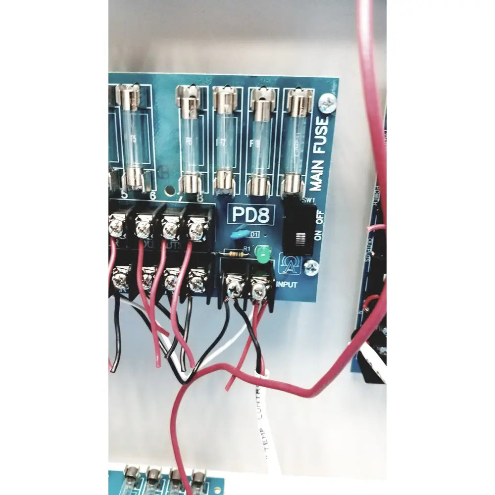 Blue Altronix SMP5CTX high current power supply circuit board with clear glass fuses and labeled terminals visible