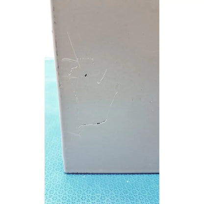 A light gray rectangular altronix smp5ctx high current power supply charger with minor scratches and a small dark spot