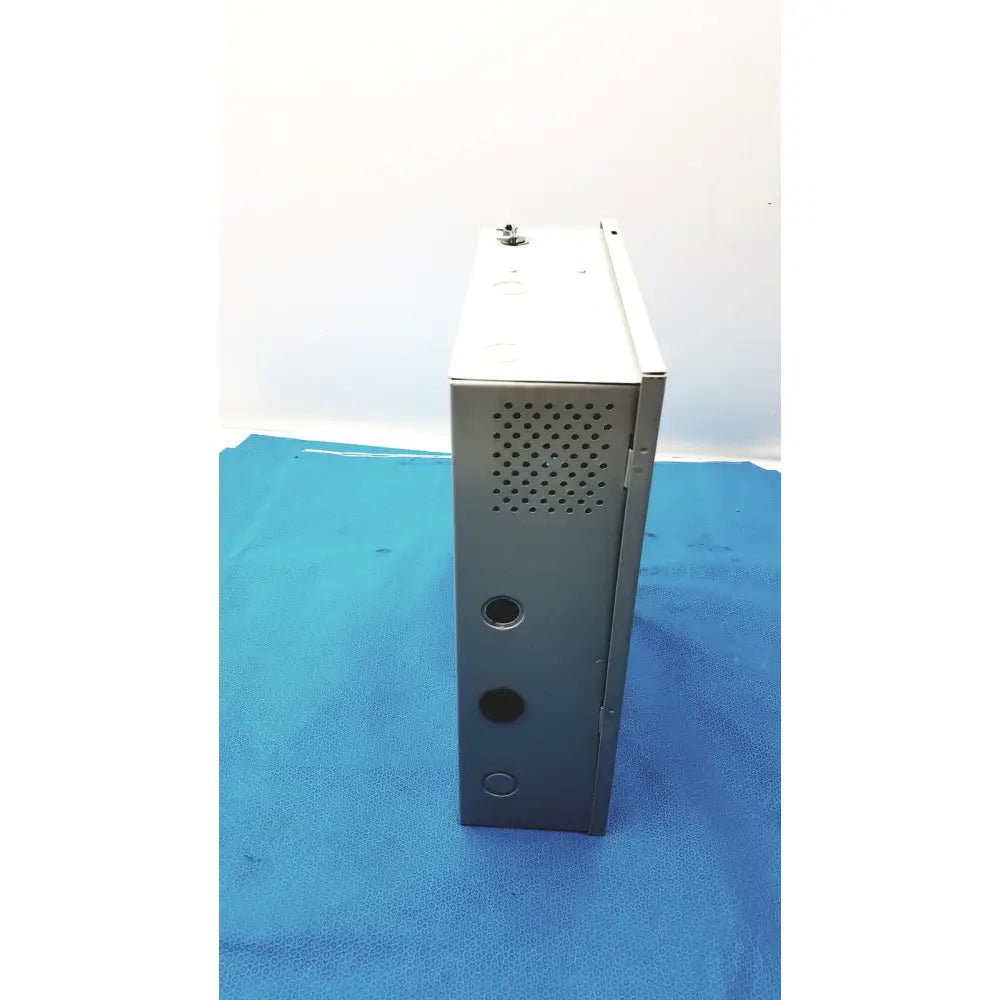 Gray metal server rack with perforated ventilation panel and mounting holes on the back of altronix smp5ctx power supply