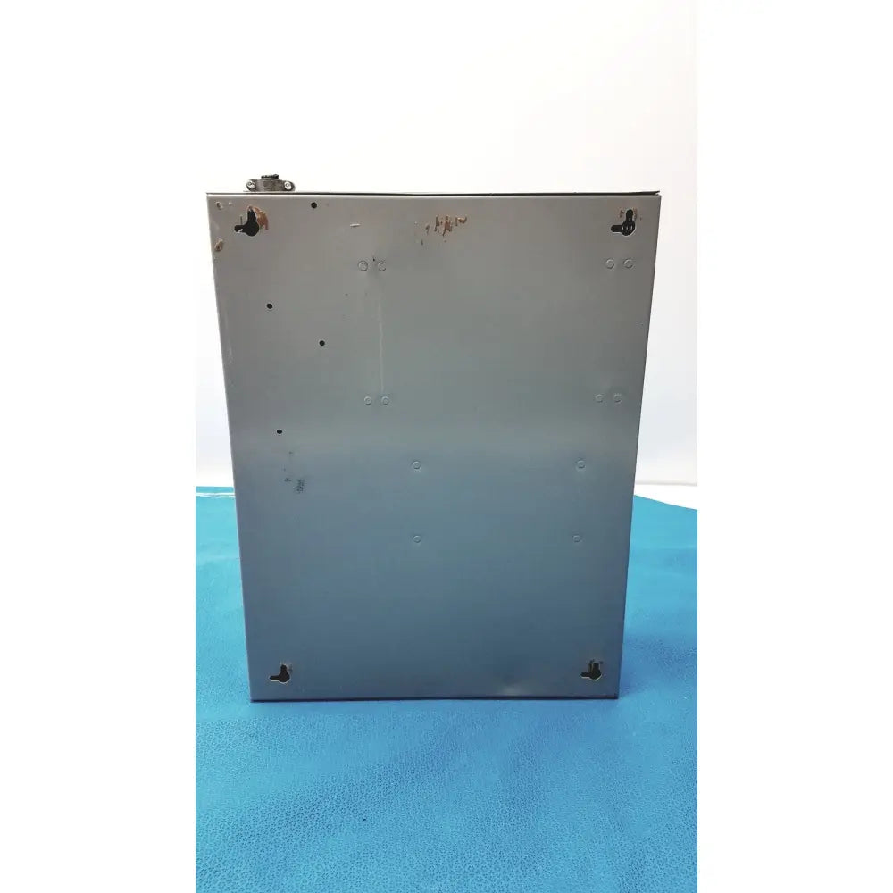 Silver metallic rectangular altronix smp5ctx power supply with mounting holes and a worn finish for 12vdc or 24vdc use
