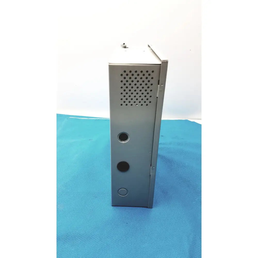Gray metal industrial enclosure with perforated panel and circular cutouts for altronix smp5ctx power supply charger