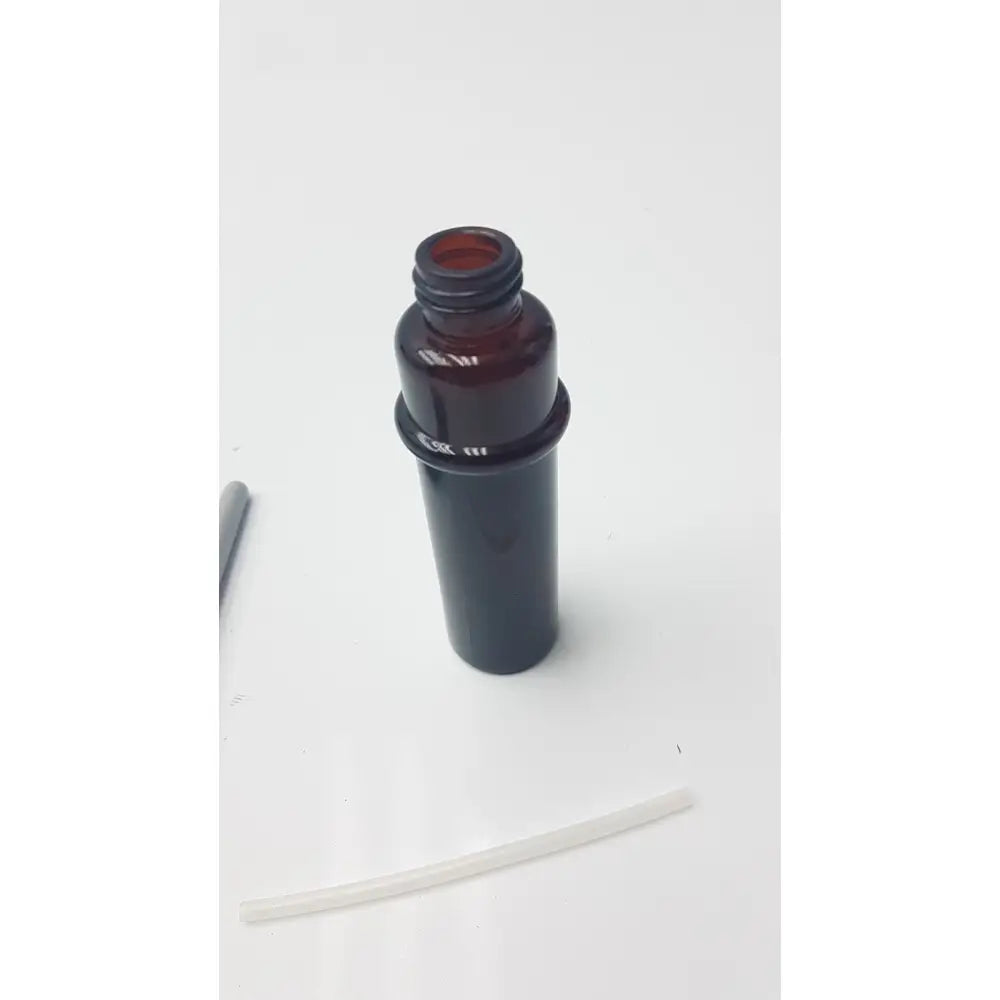 Dark amber glass plastic mist bottle with threaded neck and black plastic cap for amber plastic mist use