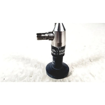 Silver and black microscope objective lens with engraved text from american cystoscope makers fo-8168m microlens barrel