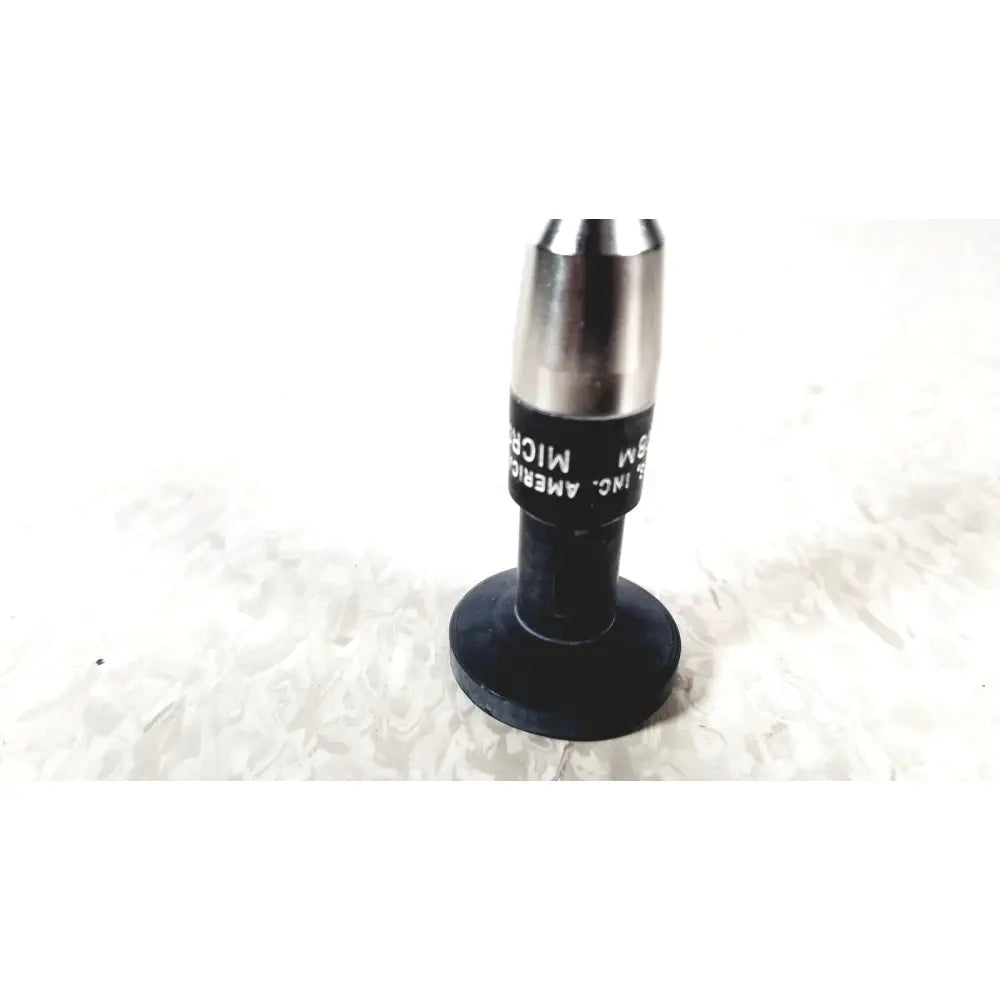 Black and silver microscope objective lens with black rubberized base from american cystoscope makers fo-8168m microlens