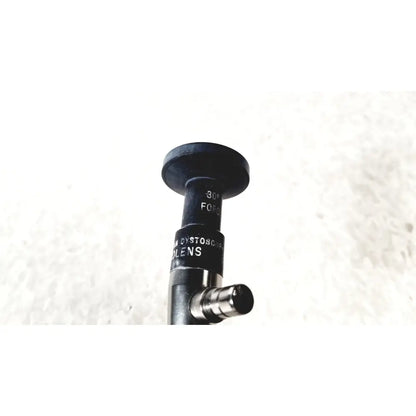 Black cylindrical cystoscope lens with matte finish and engraved markings by american cystoscope makers fo-8168m microlens