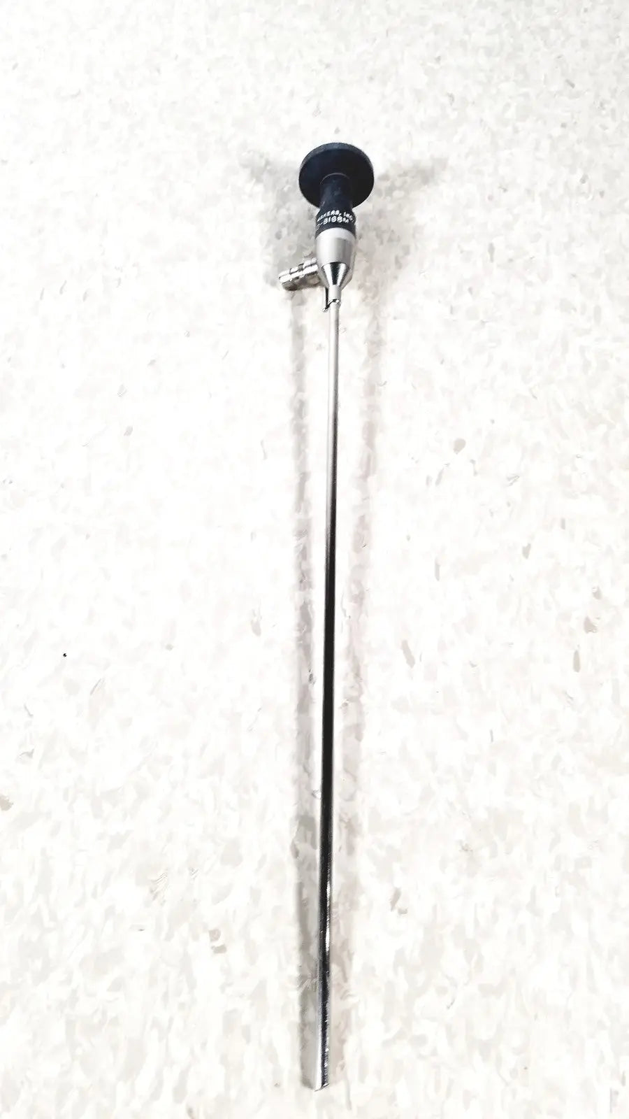 Silver surgical endoscope with black circular handle and metallic joints by american cystoscope makers fo-8168m microlens
