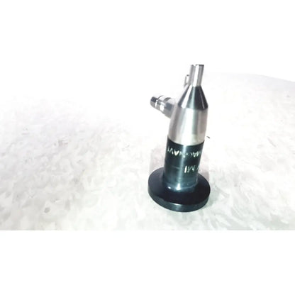 Silver metallic cylindrical microlens device with black base and threaded top by american cystoscope makers inc