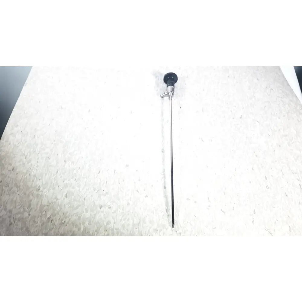 Black-tipped slender metallic shaft surgical endoscope by American Cystoscope Makers used for precise medical procedures
