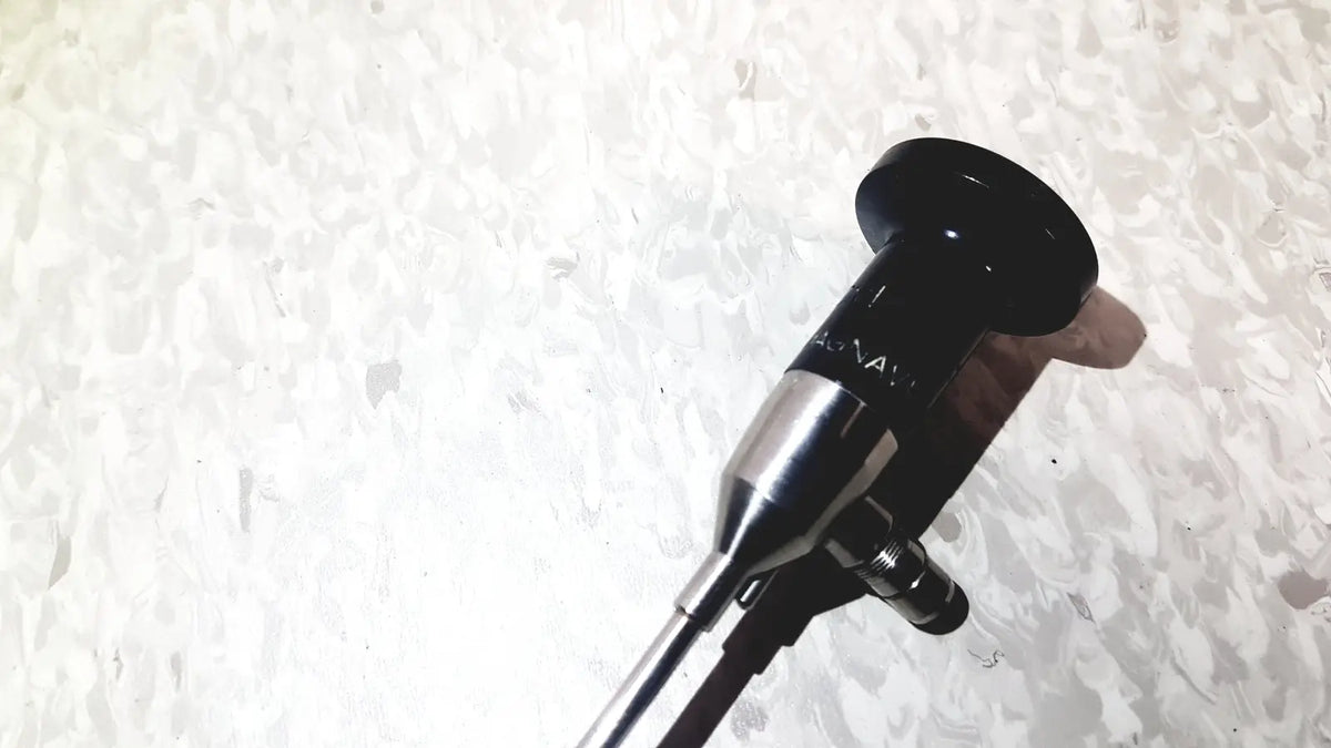 Black and silver endoscope with sleek cylindrical design by american cystoscope makers inc microlens fo-8168l