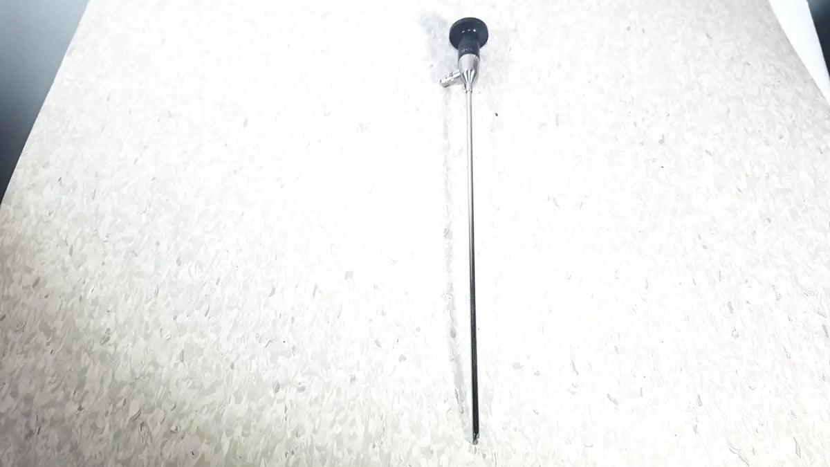 Black-tipped slender metallic shaft surgical endoscope by American Cystoscope Makers used for precise medical procedures