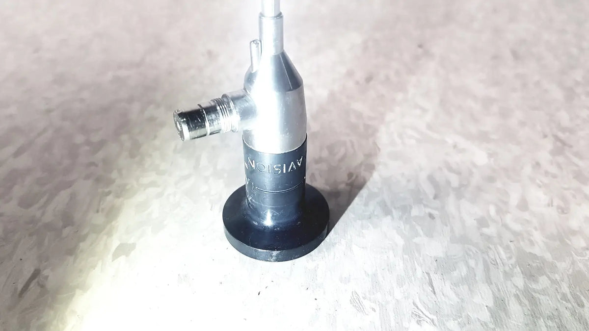 Silver and black medical endoscope with threaded connector and circular base by american cystoscope makers