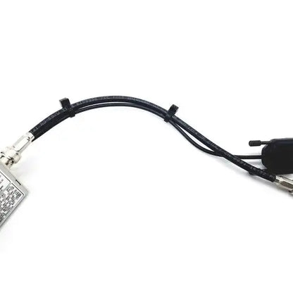 Black braided cable with metallic connectors and small plastic component for american dynamics adcshr2412n camera