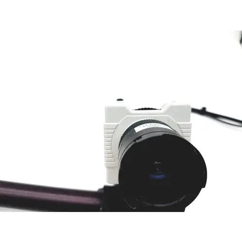 White compact american dynamics adcshr2412n super high resolution fixed camera with black lens and textured body