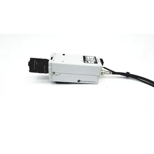 White rectangular industrial camera with black lens housing and cable branded american dynamics adcshr2412n super high resolution fixed camera