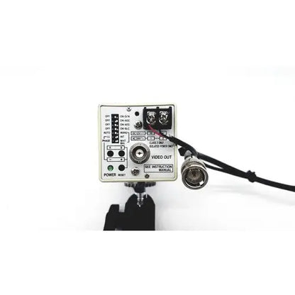 White rectangular security camera control box with black cables showing back side of american dynamics adcshr2412n super camera