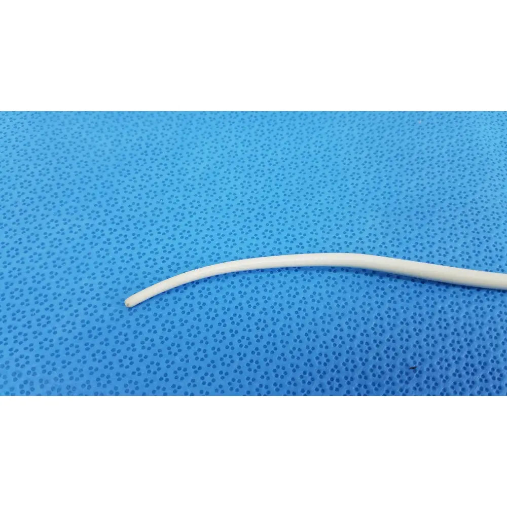 A smooth off-white american endoscopy 15fr maloney tapered tungsten-filled esophageal bougie on blue surface