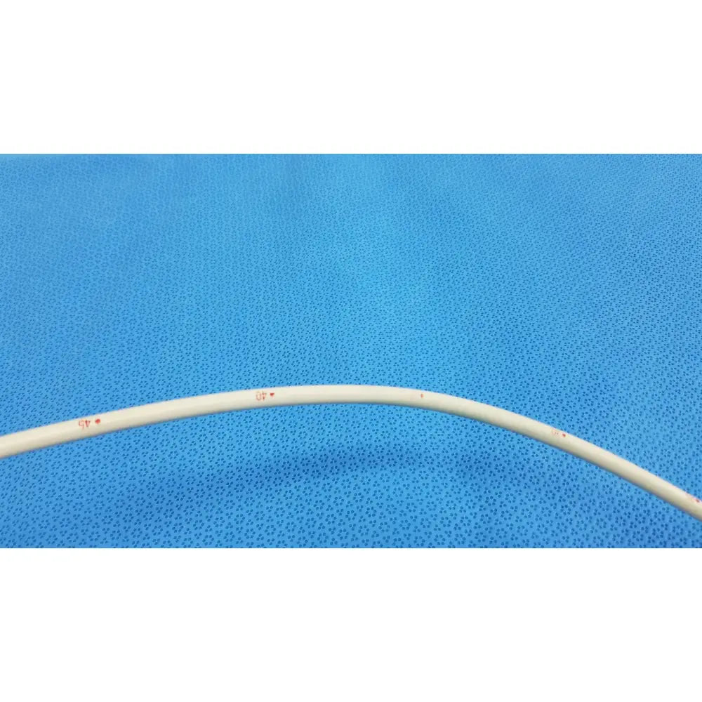 A white flexible american endoscopy 18fr maloney tapered tungsten filled esophageal bougie with red markings