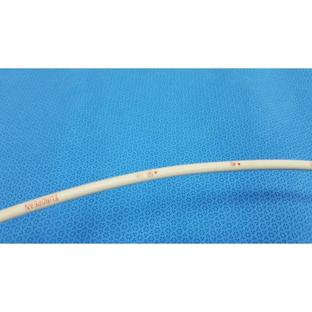 Cream-colored flexible plastic tube with red markings in american endoscopy 18fr maloney tapered tungsten-filled esophageal bougie