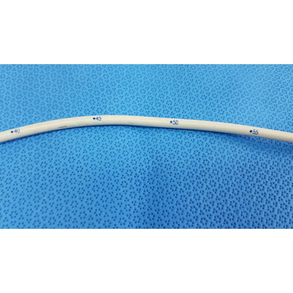 A beige flexible american endoscopy 18fr maloney tapered tungsten-filled esophageal bougie with blue measurement markings