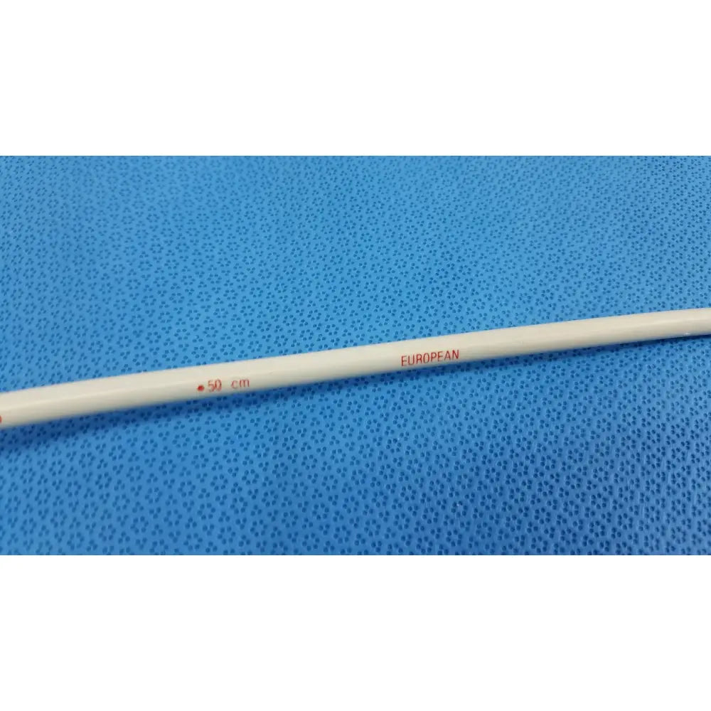 A white cylindrical laboratory thermometer marked 50 cm and european in red used with american endoscopy 24fr maloney