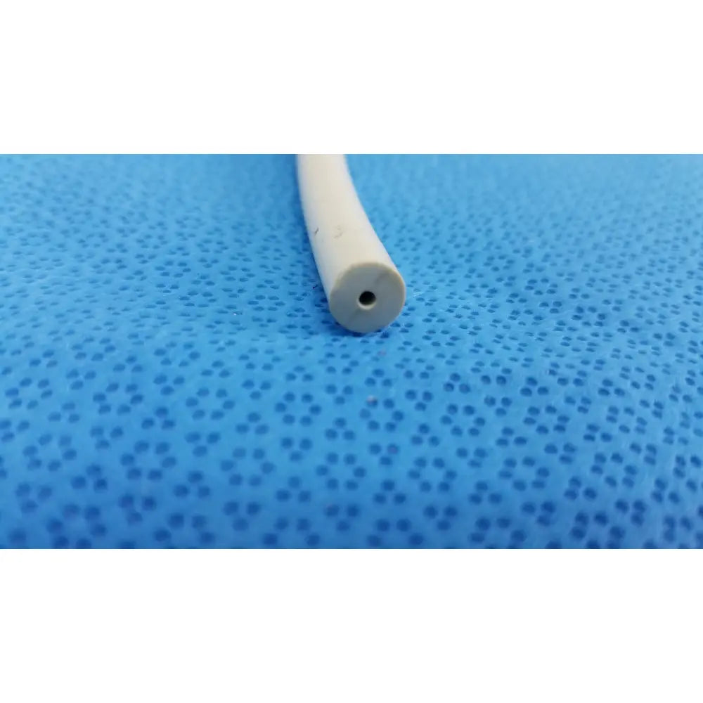 White cylindrical american endoscopy 24fr maloney tapered tungsten-filled esophageal bougie with small hole on blue surface